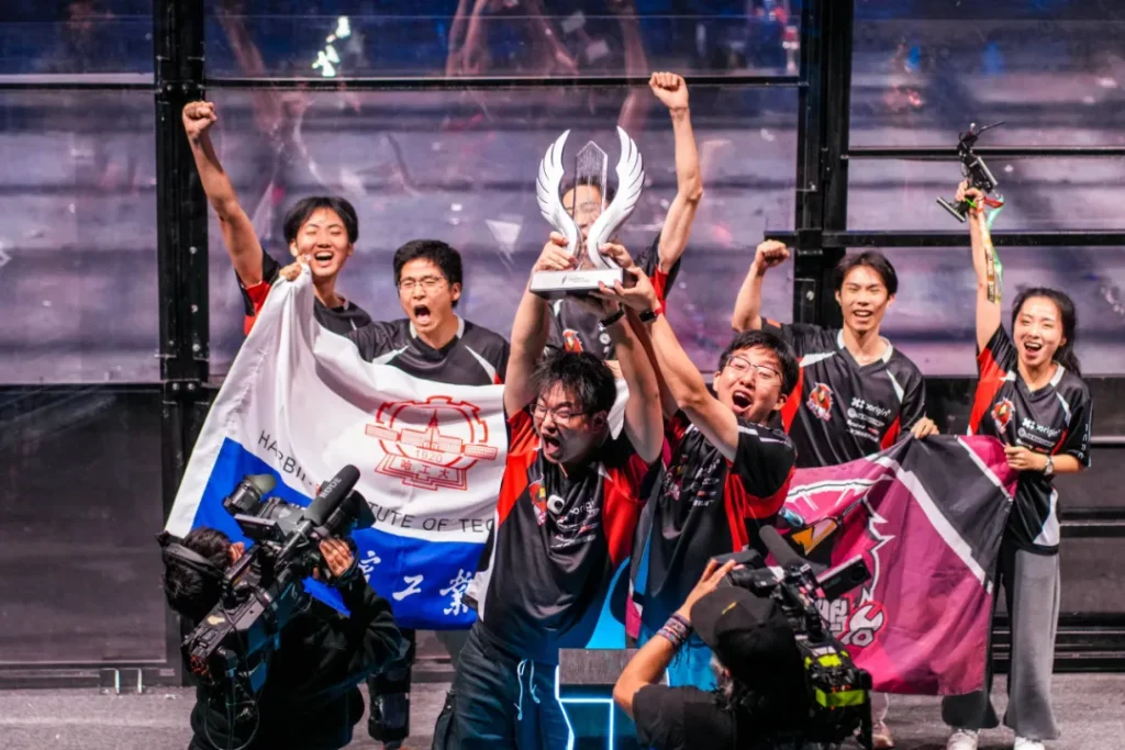 The Chinese combat robot team celebrates winning the championship.